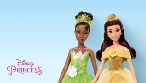 Disney Princess dolls Tiana and Belle in green and yellow gowns with tiaras, with Disney Princess text on the left.
