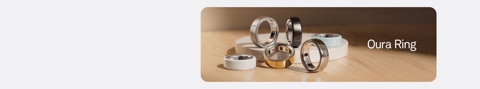 Close-up of multiple Oura Ring smart rings. Text says: Oura Ring.