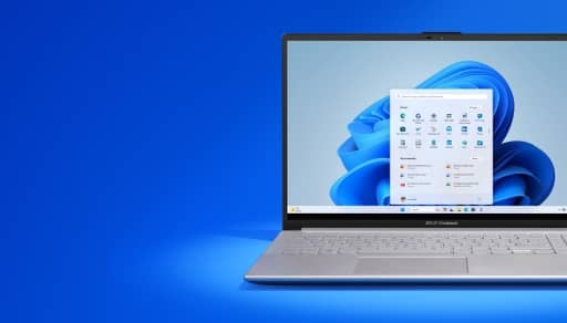 Asus Vivobook laptop with Windows home screen and centered taskbar.