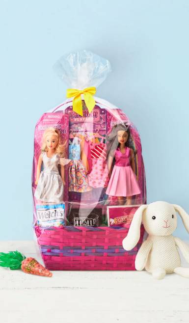 From ten dollars. Easter basket filled with dolls and candy in clear wrapping with a bow.  Reese’s carrot and rabbit plushie alongside.