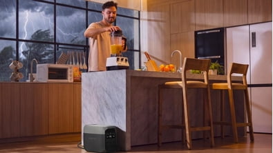 man using generator in kitchen