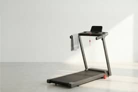 A treadmill in a sunny room.
