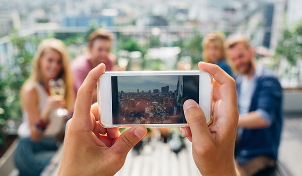 Quick-start guide to mobile photo editing apps Person taking photo on mobile phone