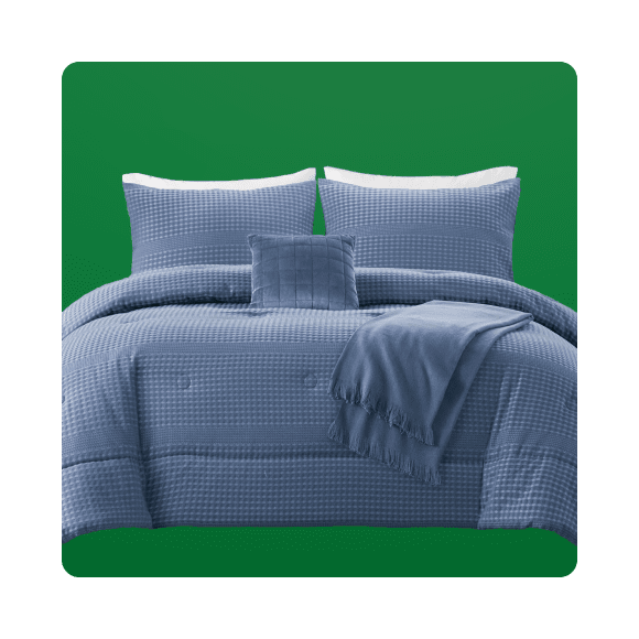 Blue pillows along with a matching blue comforter blanket is visible.