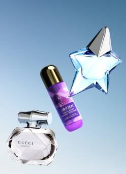 A product shot of a Gucci Bamboo perfume bottle, an Origen Himalayan Jasmine Serenade bottle, and a star-shaped Muglar perfume bottle.