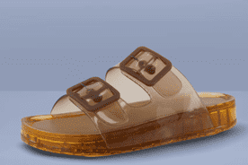 Image shows brown Cushionaire waterproof double buckle pool slides for women on a red background.