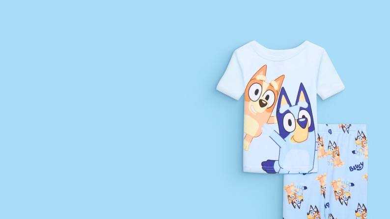 Matching pajama set featuring cartoon dogs are shown.