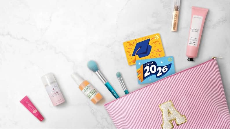 A cosmetic bag with an assortment of beauty products and gift cards.