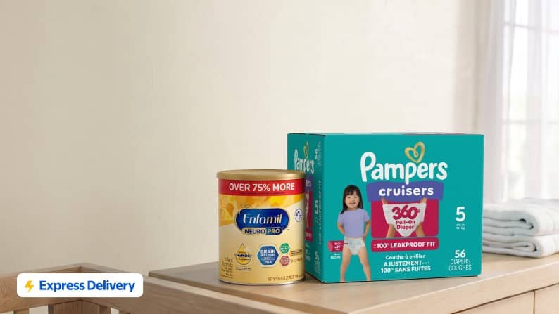 Express Delivery badge. Pampers Cruisers diapers box and Enfamil NeuroPro infant formula can on a wooden surface.
