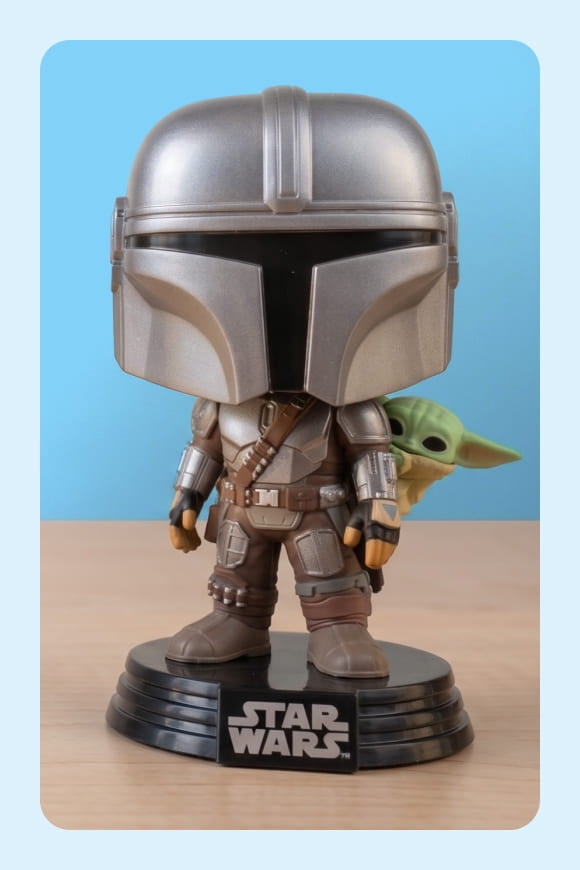 Funko Pop Star Wars Mandalorian and Grogu figures.
