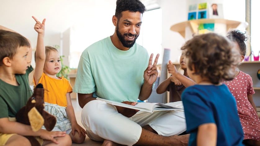 Man teaching kids in classroom.