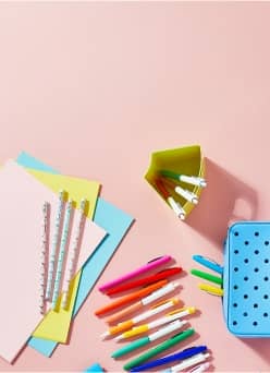 Polka dot pencil case, pens, pencils & paper.