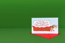 Image shows two Christmas cards. One is a pop-up card of Santa and his sleigh and the other is a card with a dog on the front.