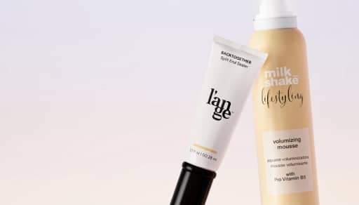 Two hair products shot against an ombre background with text, “L’ange & more. Salon-worthy haircare. Shop now.”