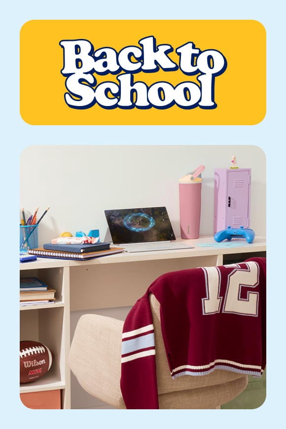 Back to school. Study desk with laptop, gaming controller, water tumbler, mini locker, notebooks, desk lamp and school jacket.