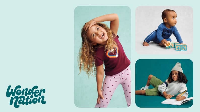 Three kids wearing a burgundy graphic tee with pink heart leggings, a blue outfit and a gray sweatshirt with green shorts and a knit beanie.