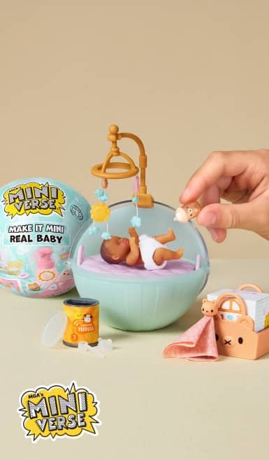 Mini Verse Make It Mini Real Baby toys with a tiny baby in a pastel cradle, a hand holding a small baby figure and miniature accessories.