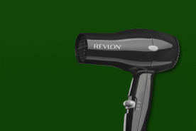 Image shows a black Revlon compact hair dryer on a dark green background.
