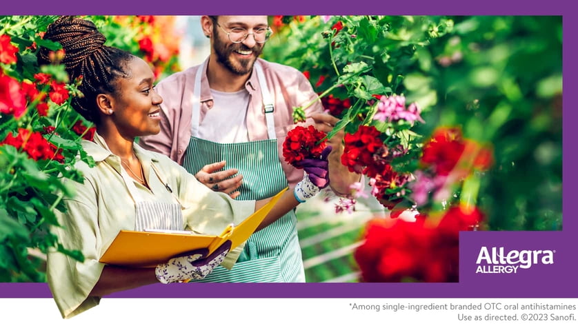 A man and woman garden together.
