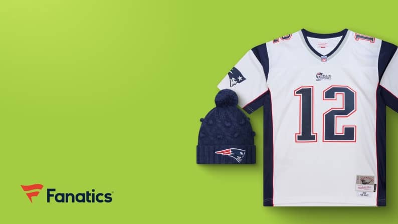 View a New England Patriots jersey with the number twelve and a beanie with the team logo on it.