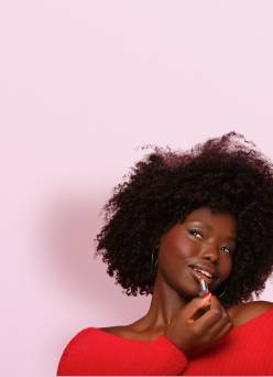A model applies lipstick.