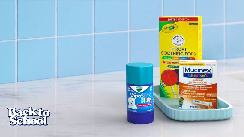Product display featuring Vicks VapoStick, Bee Keeper’s Naturals Kids Throat Soothing Pops, and Mucinex Children’s.