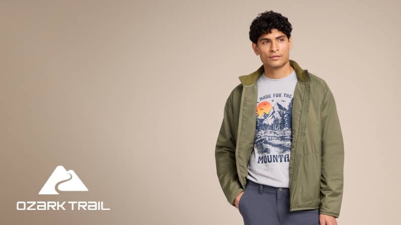 Ozark Trail logo. A man in a green jacket and graphic t-shirt is pictured on a beige backdrop.