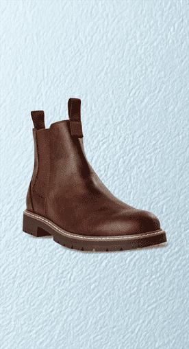 Image shows brown Portland Boot Company men's casual Chelsea boots on a light blue textured background.