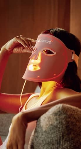 Model wears a Solawave Wrinkle Retreat Pro Light Therapy Face Mask.