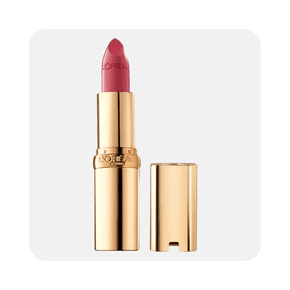 Image shows a gold tube of Loreal Paris Colour Riche lipstick in a plum shade on a light gray background.