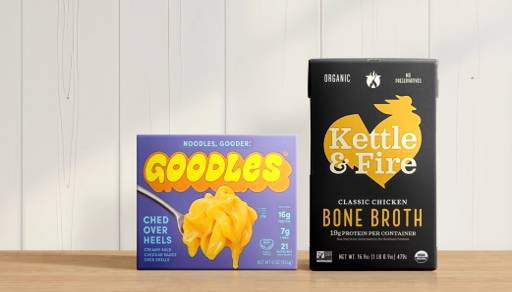 A box of Goodles mac & cheese is shown, next to a box of Kettle & Fire bone broth.