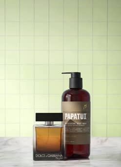 Papatui body wash and Dolce and Gabbana cologne on bathroom counter.