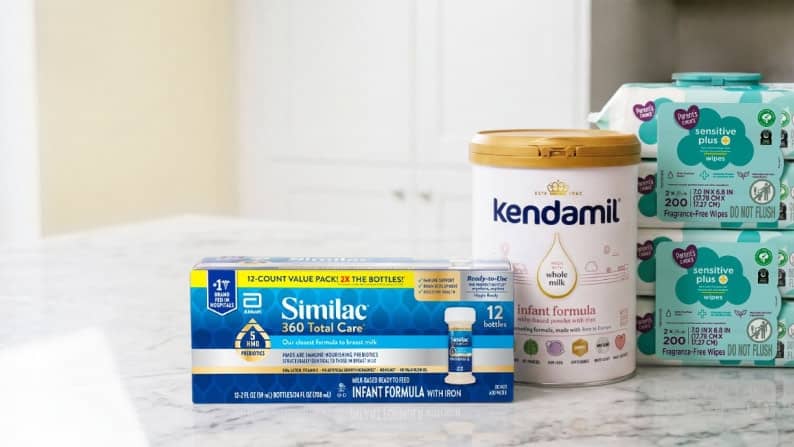 A variety of bulk baby supplies including a 12-pack of Similac liquid formula bottles, Kendamil infant formula, and packs of sensitive wipes.