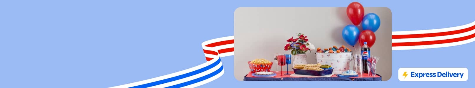 Red, white and blue balloons, next to food and party supplies on a table. Express Delivery badge.