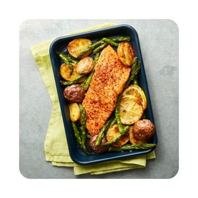 A prepared plate of grilled salmon, asparagus, and potatoes