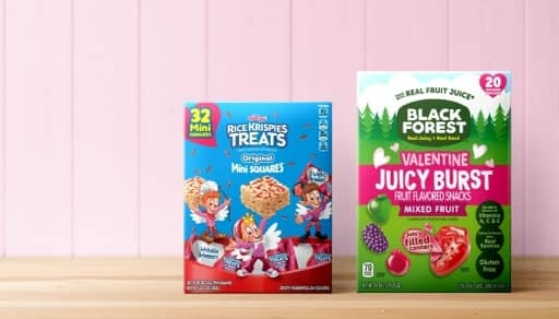 A box of RIce Krispies Valentine’s mini treats is shown next to a Black Forest Valentine juicy burst fruit snack box.