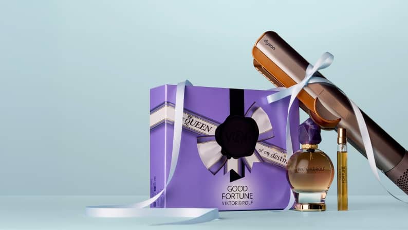 A fragrance gift set & a hair tool from different brands are shown.