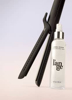 Image of a hair tool and haircare product is shown.