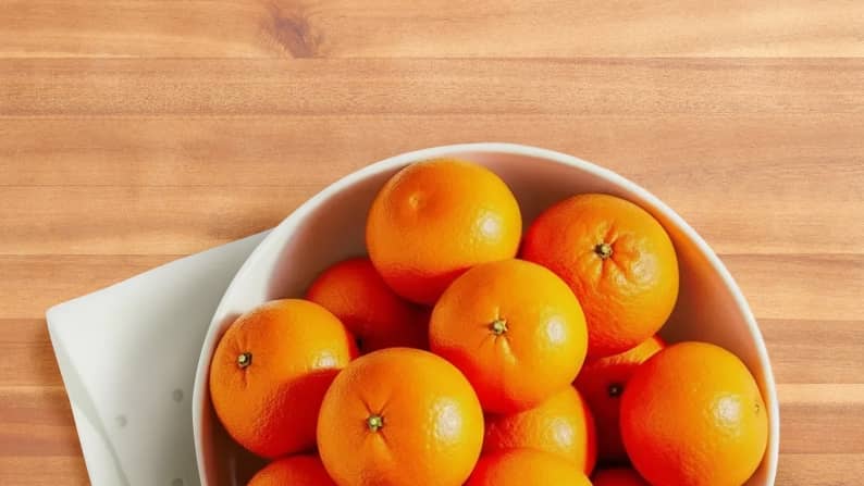 A bowl of oranges are shown.