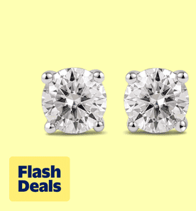 Image shows shiny round-cut lab-grown diamond earrings in white gold plating by JeenMata on a light yellow background.