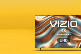Image shows a Vizio smart TV with a colorful display on a yellow background.