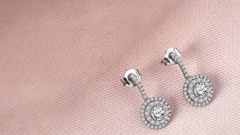 Shimmering circular pendant drop earrings.