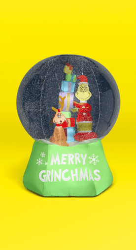 Image shows a multicolor Dr. Seuss' The Grinch yard inflatable with Max and a sleigh in a snow globe on a yellow background.