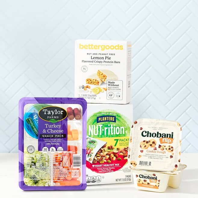 Taylo Farms snack pack, bettergoods protein bars, Planters nut mix and Chobani flip.