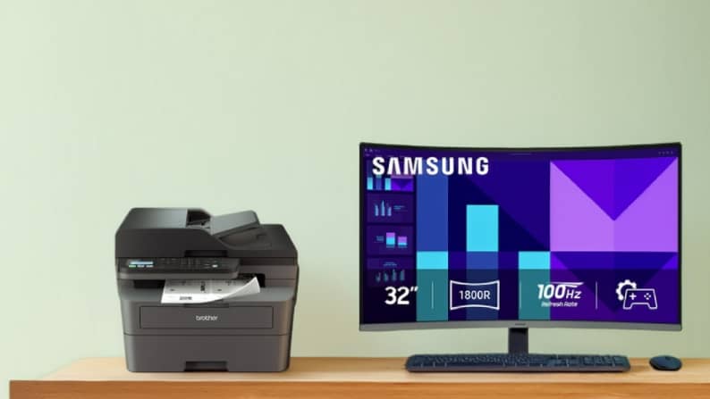 Printer and Samsung screen on a wooden desk.