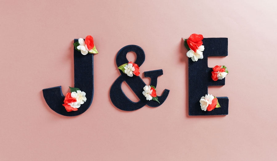 completed floral letter with strewn flowers