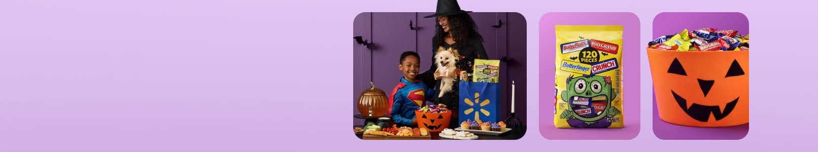 A woman in a witch costume and kid in a Superman costume with a spread of food, a candy bucket, and a variety candy bag.