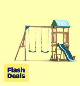 Image shows a natural wooden Dolphin Playground swing set with green swings, slide and playhouse on a light yellow background.