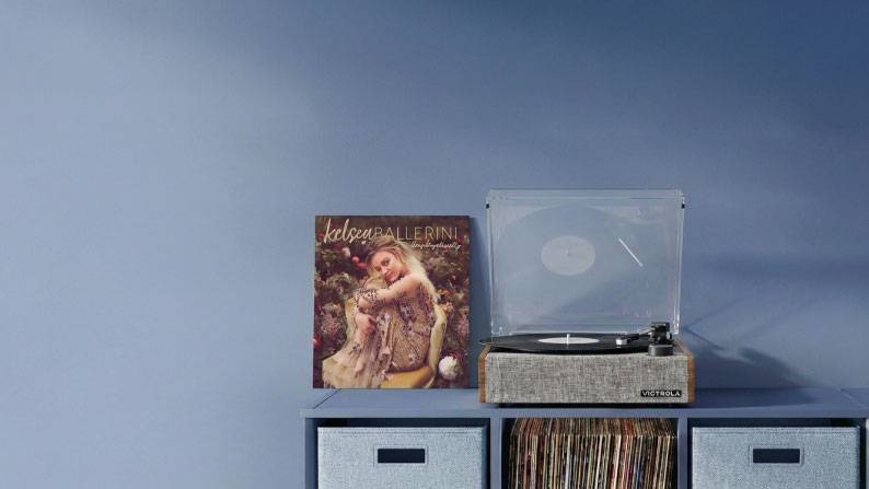 View a record player on top of a table with a Kelsea Ballerini album next to it. Up to twenty percent off.