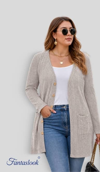 Fantaslook long beige ribbed cardigan with buttons and pockets worn over white top and blue jeans by an accessorized adult.